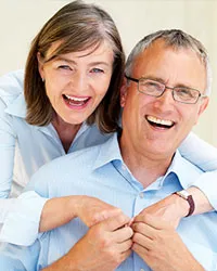 An older woman and man smiling