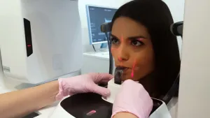Woman using a laser imaging device